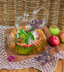 Herbal tea with apples, oregano, mint and rose