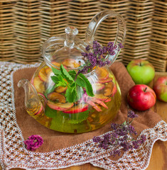 Herbal tea with apples, oregano, mint and rose