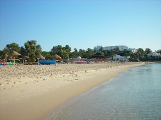 Sandy beach in the Tunisian seaside resort Hammamet on a sunny afternoon in early fall.