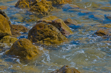 Stones in transparent sea water