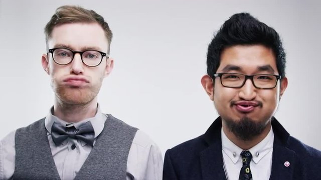 Men pulling funny faces slow motion wedding photo booth series