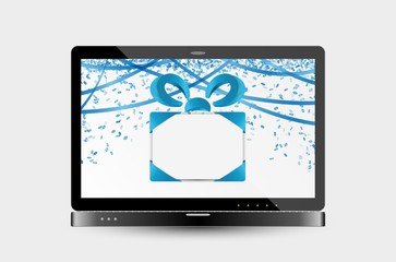 gift with ribbons and confetti on laptop screen