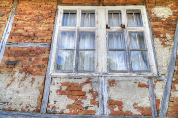 Old wooden windows on brick wall