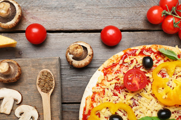 Food ingredients for pizza on table close up