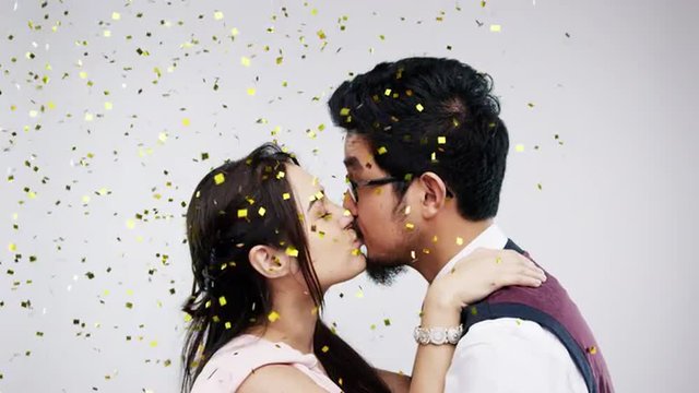 Mixed race couple kissing slow motion wedding photo booth series