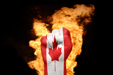 fire fist with the national flag of canada
