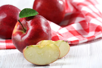 Ripe red apples on table close up
