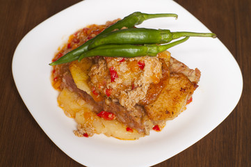 meatloaf with mashed potatoes and green chillies