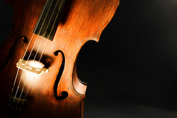 Vintage cello on dark background
