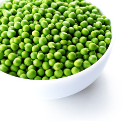 Fresh green peas in bowl isolated on white
