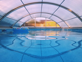 Covered swimming pool with blue water