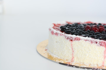 Fresh fruit cake on white background