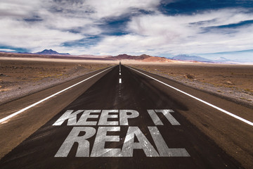 Keep it Real written on desert road