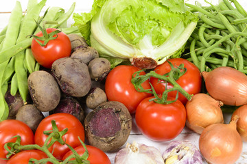 various vegetables on a white wooden table