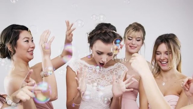 Beautiful bridesmaids dancing bubbles slow motion wedding photo booth series