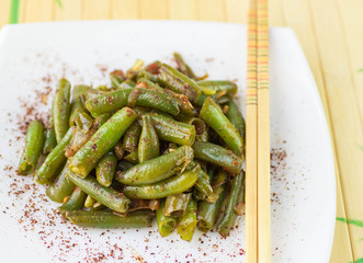Green beans with garlic, onion and red pepper. Warm salad
