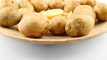 Young potatoes on plate close up