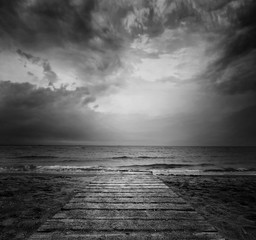 Bridge into the sea - loneliness concept in BW © Sensay