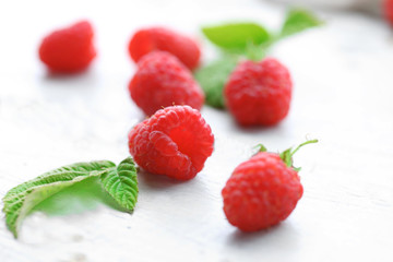 Fresh raspberries on wooden table, closeup