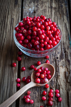 fresh cranberry (cowberry) on wooden background