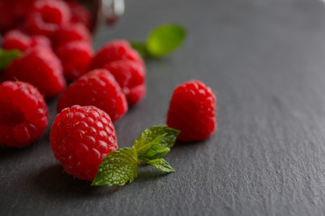 Fresh red raspberries on wooden table, closeup