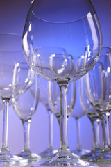 Empty wine glasses on blue background