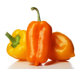 Group of yellow peppers isolated on white