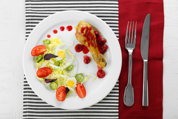 Tasty dinner served with wine on table close up