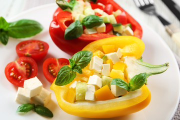 Fresh green salad in pepper on table close up