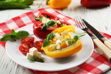 Fresh green salad in pepper on table close up