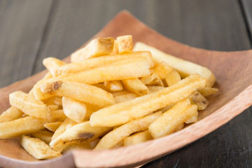 french fries on wood background