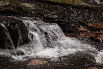 Mountain waterfall tumbling over rocks