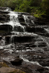 Mountain waterfall tumbling over rocks