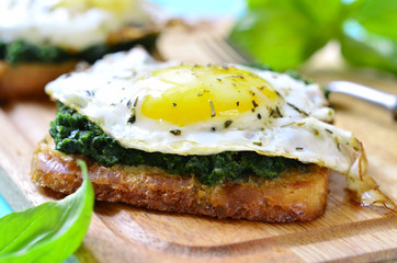 Toast with spinach and fried egg.