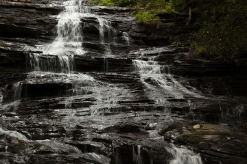 Mountain waterfall tumbling over rocks
