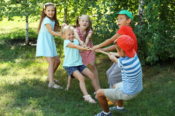 Fototapeta premium Happy active children playing in park