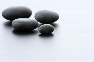 Fototapeta na wymiar Spa stones on gray background