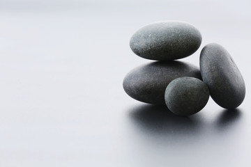 Fototapeta na wymiar Spa stones on gray background