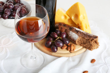 Set of products with wine bottle on light background