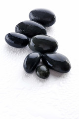 Wet spa stones isolated on white