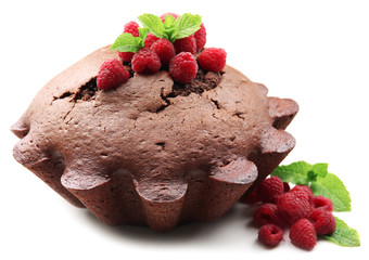 Tasty chocolate muffin with raspberries isolated on white