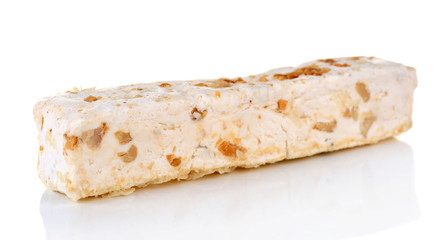 Sweet nougat with hazelnuts isolated on white