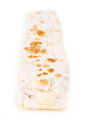 Sweet nougat with hazelnuts isolated on white