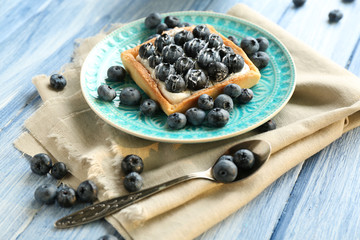 Still life with gourmet fresh blueberry tart