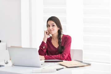 Portrait of a dark braided hair woman home working in casual clo