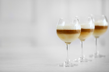 Wine glass with jelly on light background