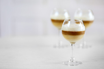 Wine glass with jelly on light background