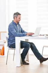 Side view of a designer working in an open space on some new pro