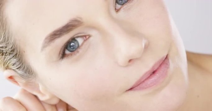 Closeup Beauty portrait of woman face with bright blue eyes skincare concept - Red Epic Dragon