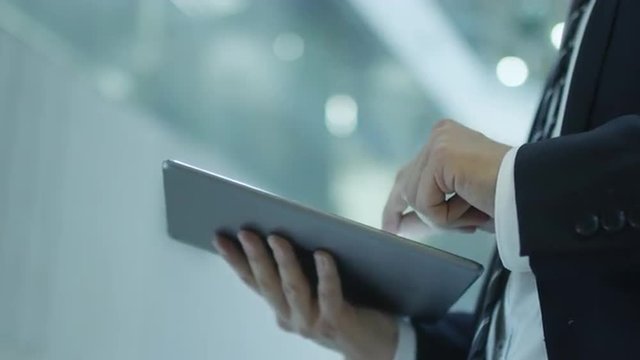 Businessman Working on Tablet in Office